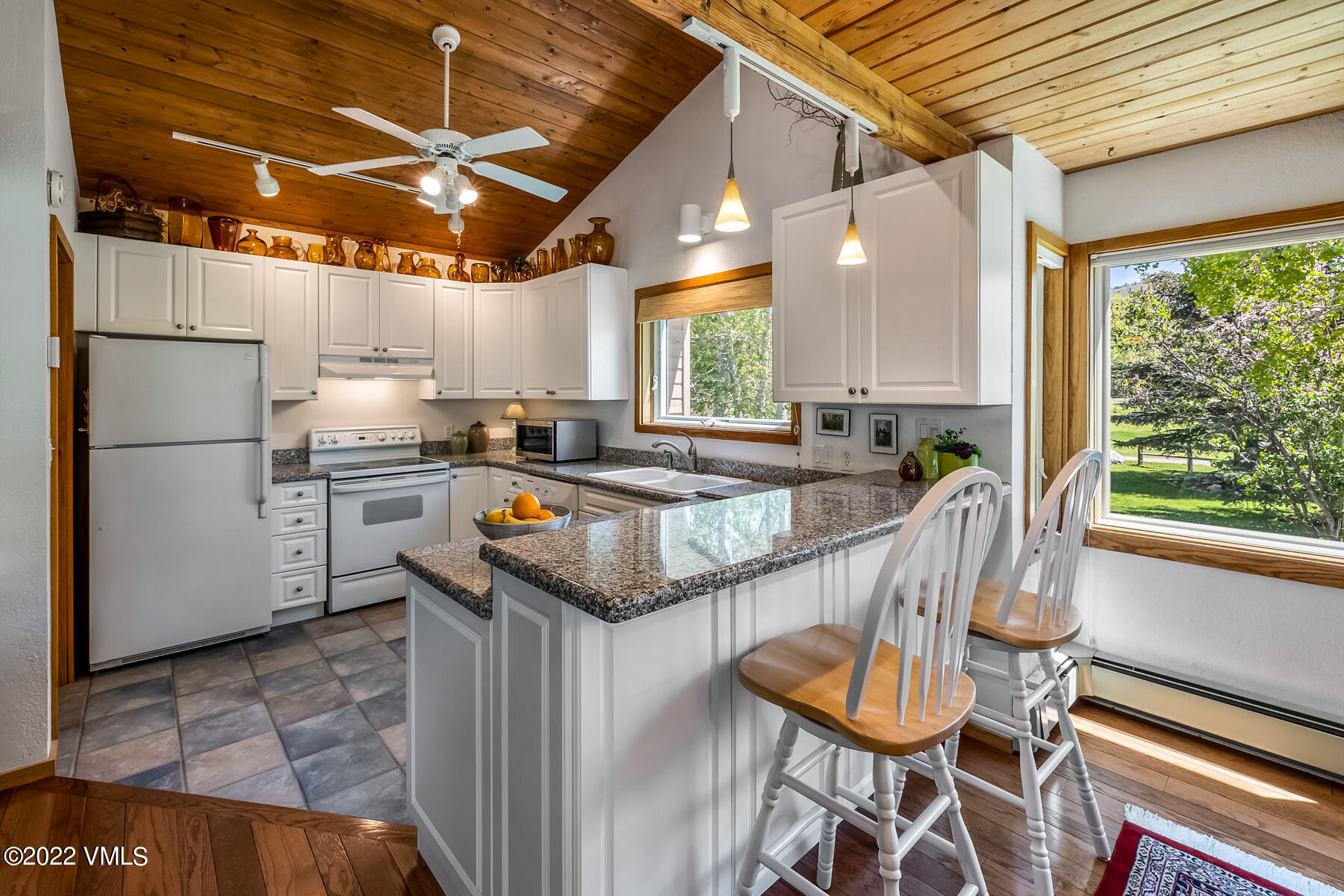 8 Deer Boulevard Eagle-Vail, CO 81620 - Photo 6 of 34 a kitchen with stainless steel appliances granite countertop a sink window and a refrigerator