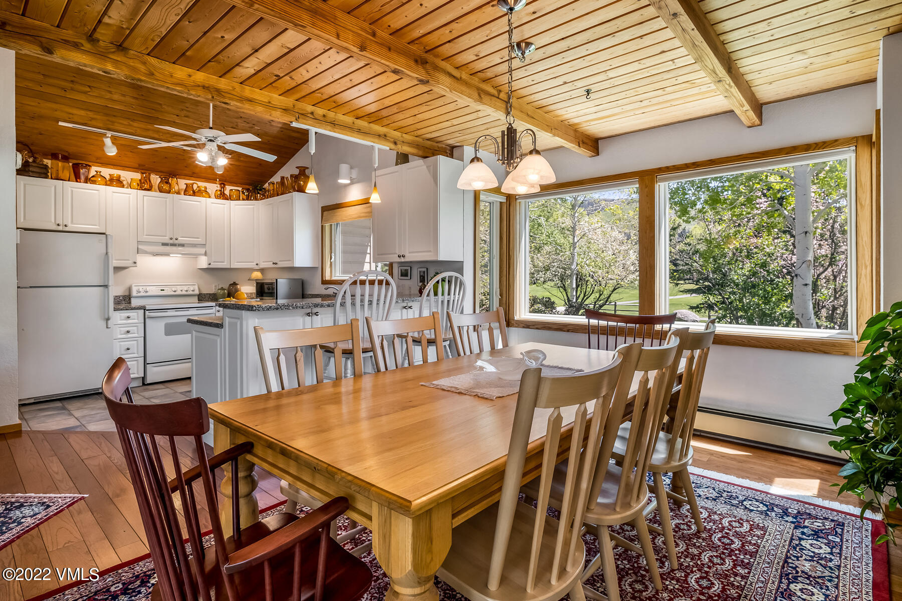 8 Deer Boulevard Eagle-Vail, CO 81620 - Photo 7 of 34 a dining space with furniture a rug and a chandelier