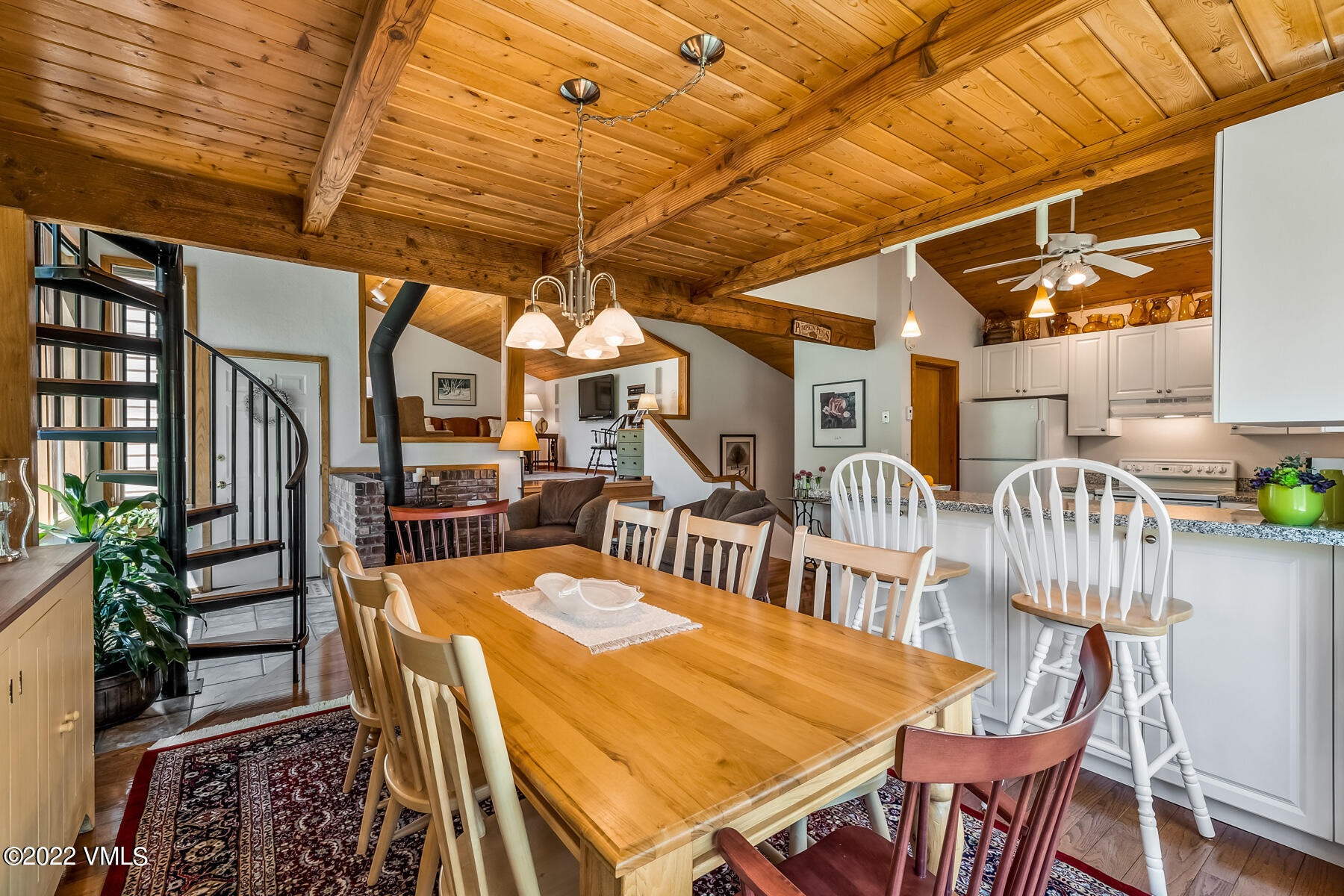 8 Deer Boulevard Eagle-Vail, CO 81620 - Photo 8 of 34 a dining room with lots of wooden furniture