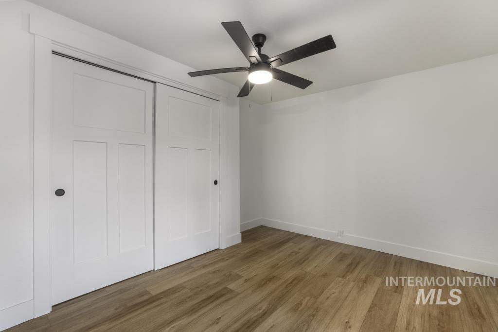 344 Fillmore Street Twin Falls, ID 83301 - Photo 19 of 42 Unfurnished bedroom featuring wood finished floors, a closet, and a ceiling fan