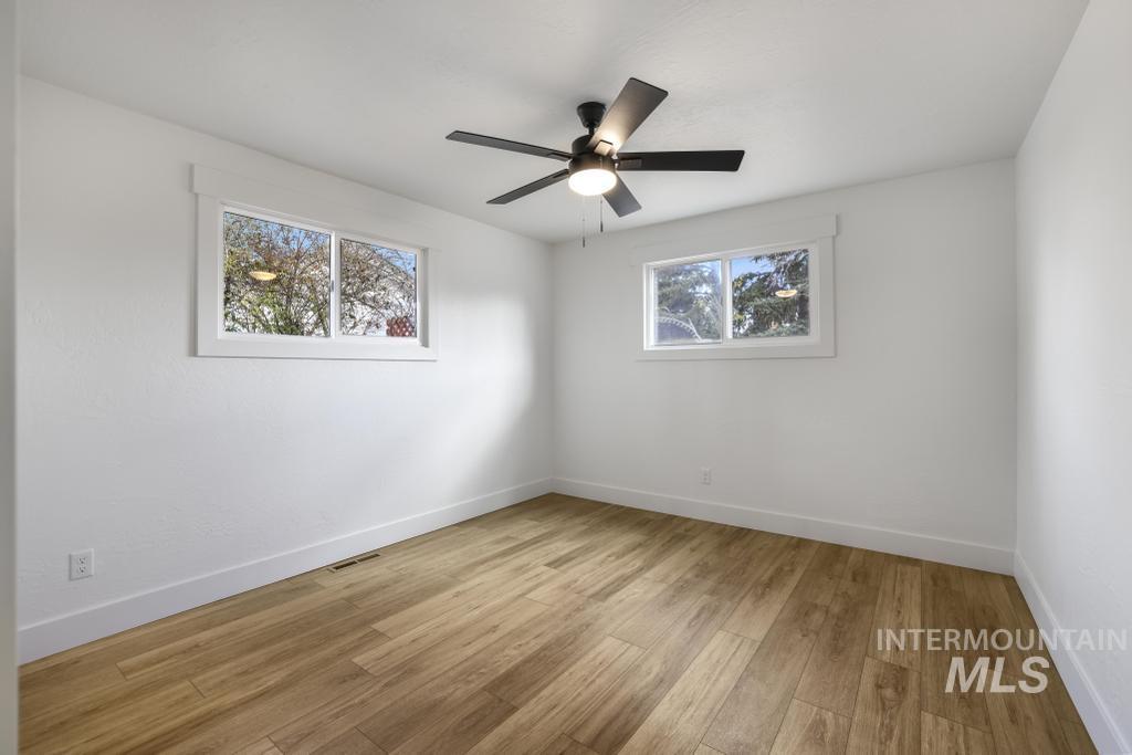 344 Fillmore Street Twin Falls, ID 83301 - Photo 22 of 42 Unfurnished room featuring light wood finished floors and a ceiling fan