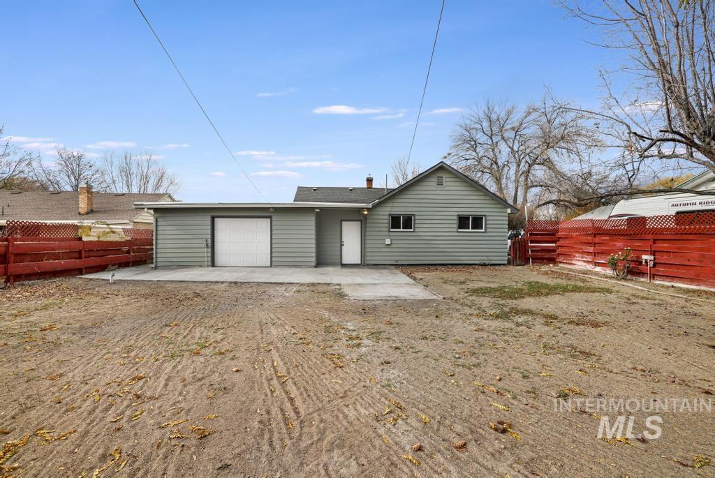 344 Fillmore Street Twin Falls, ID 83301 - Photo 30 of 42 Rear view of property featuring a fenced backyard, a patio, and a garage