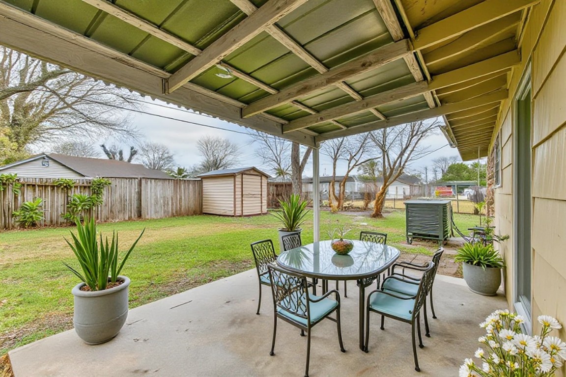 5855 Beldart Street Houston, TX 77033 - Photo 12 of 26 a dining room with a table and chairs