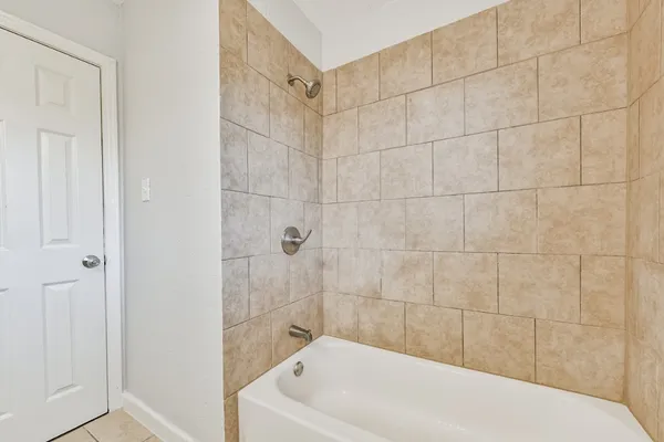 a bathroom with a white bathtub