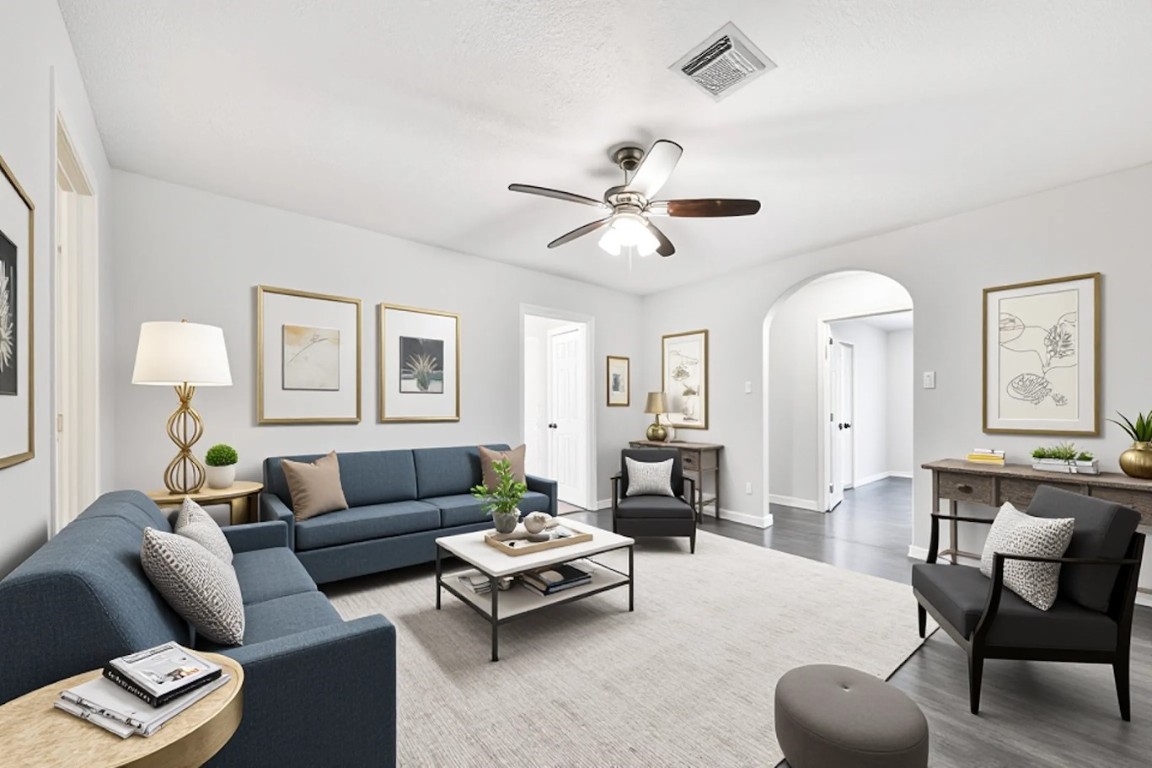 5855 Beldart Street Houston, TX 77033 - Photo 5 of 26 a living room with furniture ceiling fan and a window