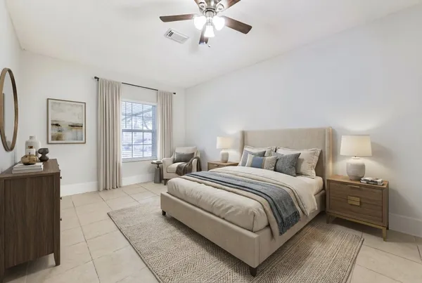 a bedroom with bed and window