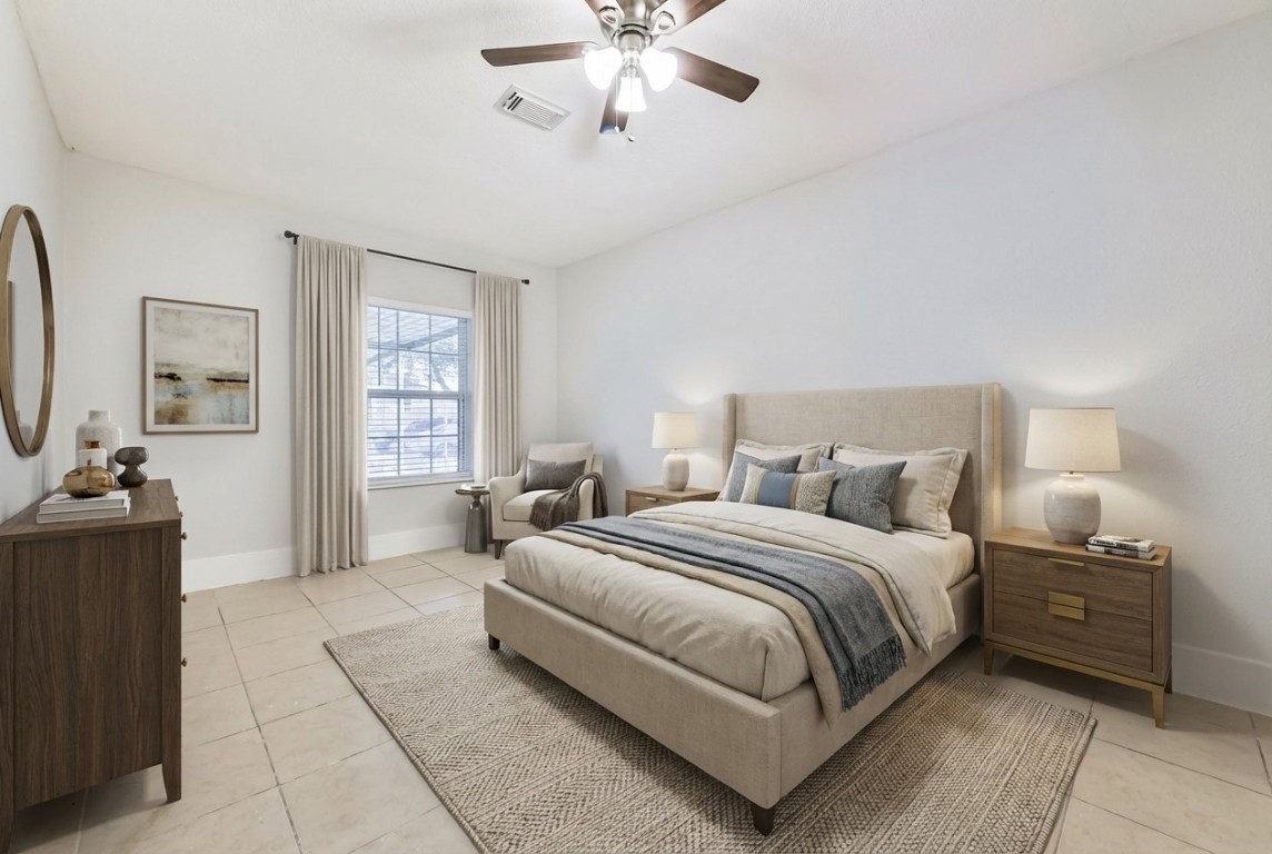 5855 Beldart Street Houston, TX 77033 - Photo 7 of 26 a bedroom with bed and window