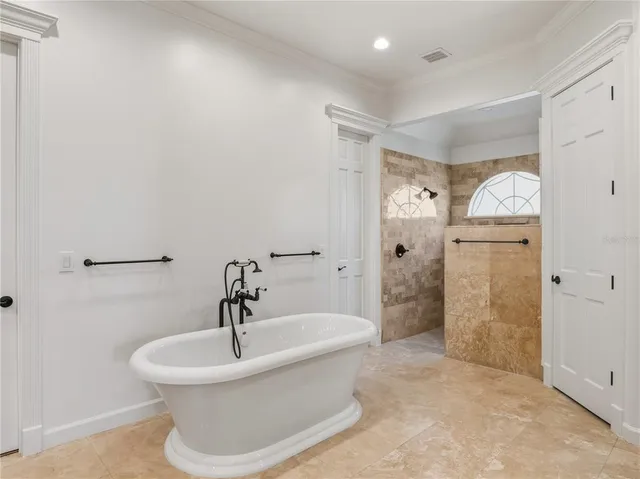 a white bath tub sitting in a bathroom