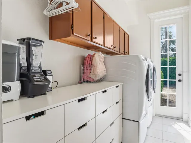 a kitchen with cabinets and window