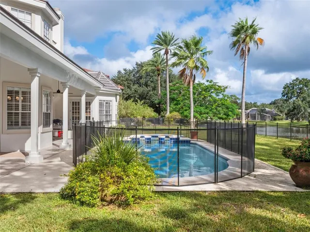 a view of a swimming pool with a patio