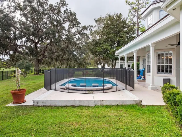 a view of a house with a yard patio and a patio