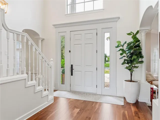 a view of entryway with wooden floor