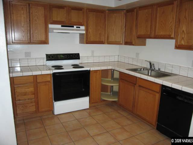 1901 West 6th Street Reno, NV 89503 - Photo 3 of 9 a kitchen with a sink and a stove top oven