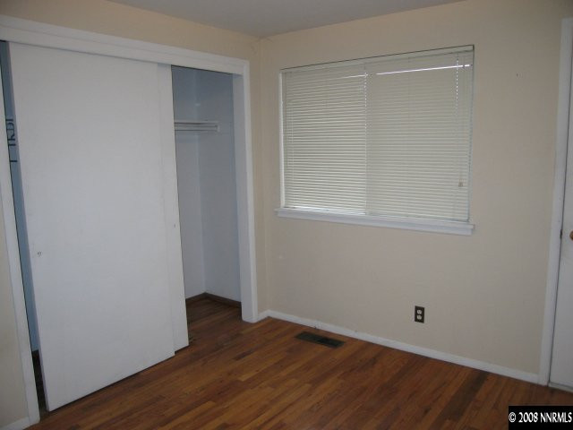 1901 West 6th Street Reno, NV 89503 - Photo 5 of 9 a view of an empty room with wooden floor and a window