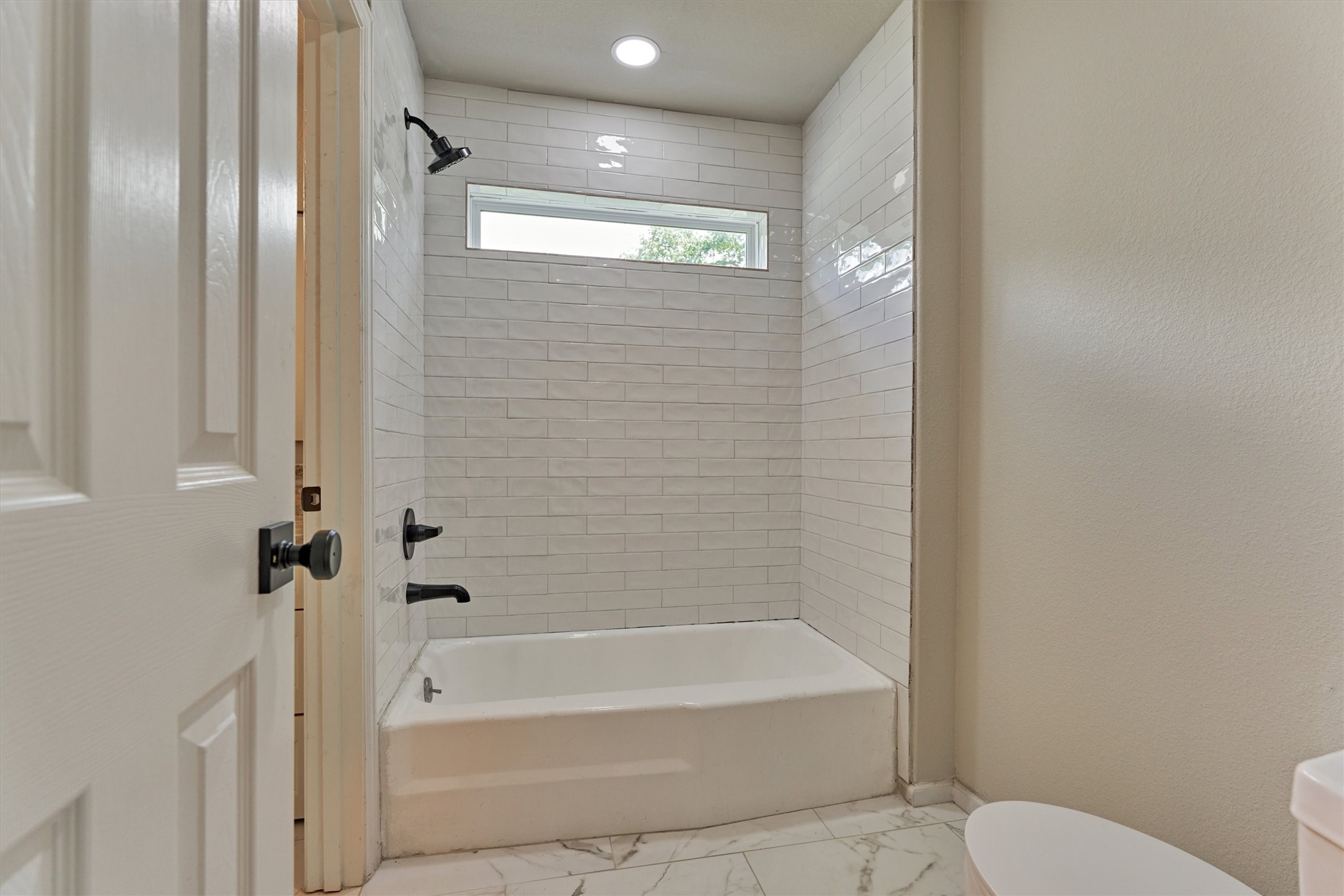 6107 Jadecrest Court Spring, TX 77389 - Photo 29 of 40 a bathroom with a bathtub and a shower