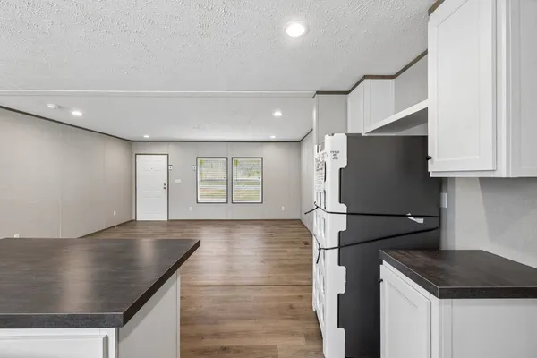 a kitchen with stainless steel appliances granite countertop a stove and a sink