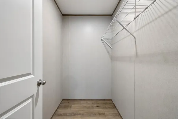 a view of hallway with wooden floor