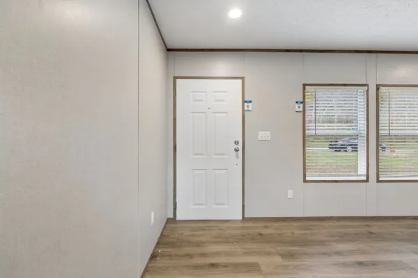 a view of kitchen with refrigerator stove microwave and cabinets