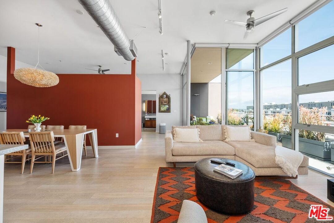 4080 Glencoe Avenue, Unit 420 Marina del Rey, CA 90292 - Photo 12 of 40 a living room with furniture a bed and a table
