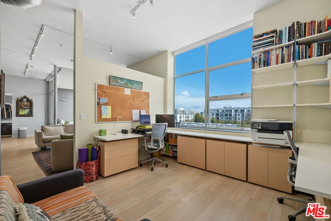 4080 Glencoe Avenue, Unit 420 Marina del Rey, CA 90292 - Photo 13 of 40 a living room with stainless steel appliances furniture a rug and a large window