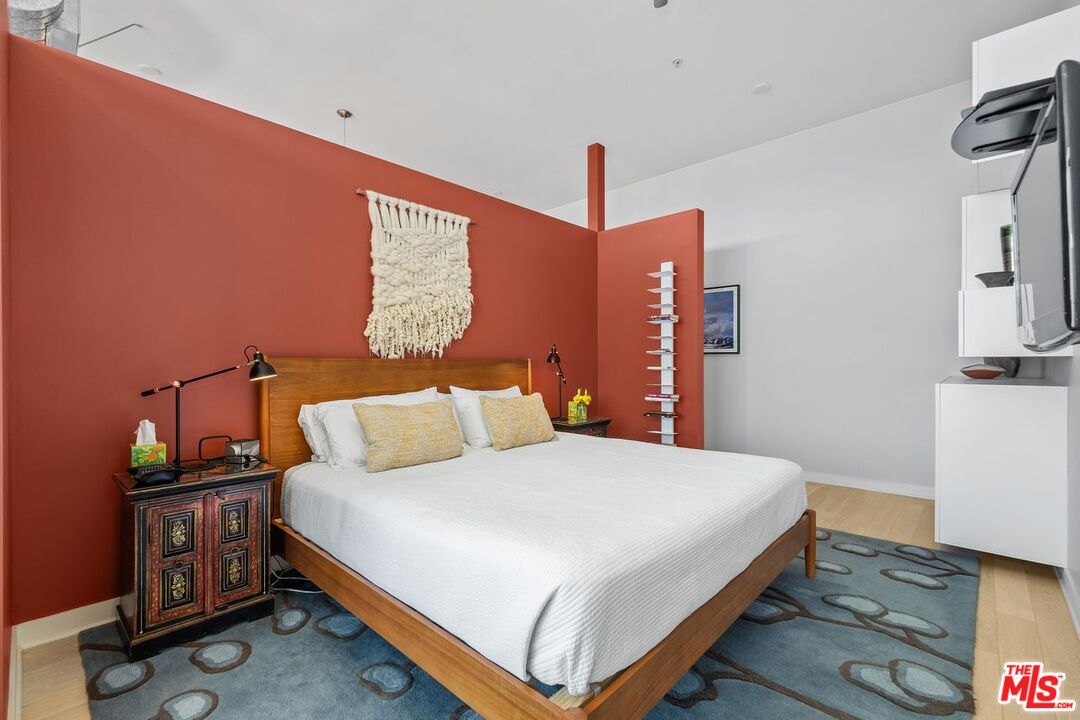 4080 Glencoe Avenue, Unit 420 Marina del Rey, CA 90292 - Photo 15 of 40 a bedroom with a bed and a table in it