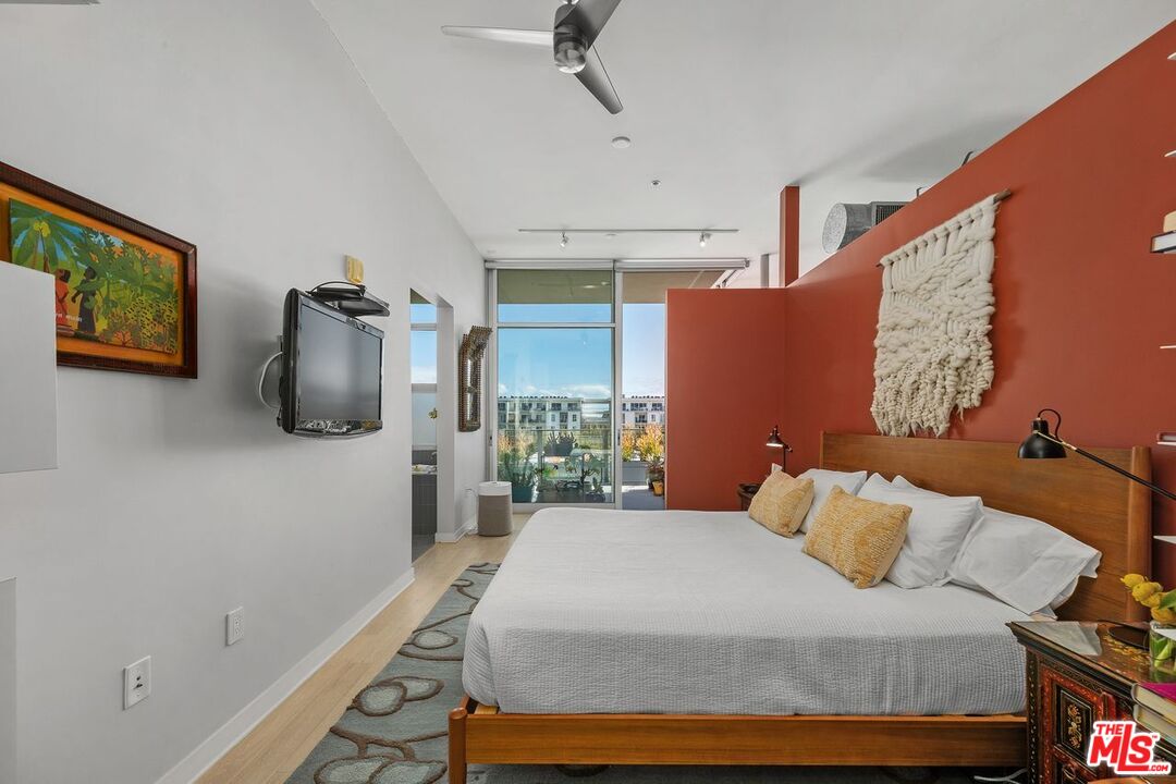 4080 Glencoe Avenue, Unit 420 Marina del Rey, CA 90292 - Photo 16 of 40 a bedroom with a bed and flat screen tv