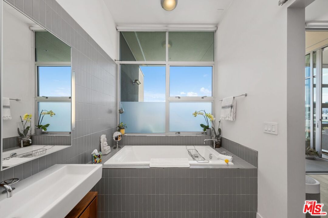 4080 Glencoe Avenue, Unit 420 Marina del Rey, CA 90292 - Photo 20 of 40 a bathroom with a sink and a mirror
