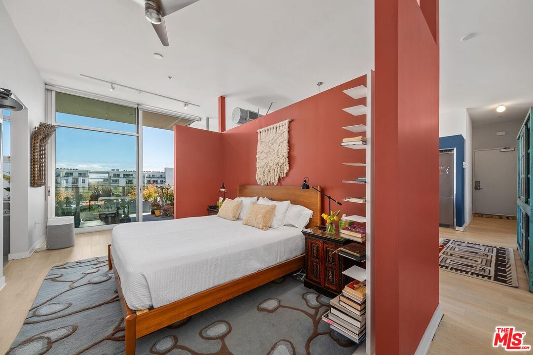 4080 Glencoe Avenue, Unit 420 Marina del Rey, CA 90292 - Photo 23 of 40 a bedroom with a bed and wooden floor