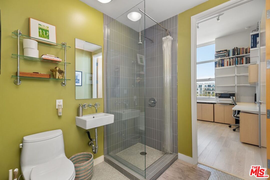 4080 Glencoe Avenue, Unit 420 Marina del Rey, CA 90292 - Photo 24 of 40 a bathroom with a sink toilet and shower