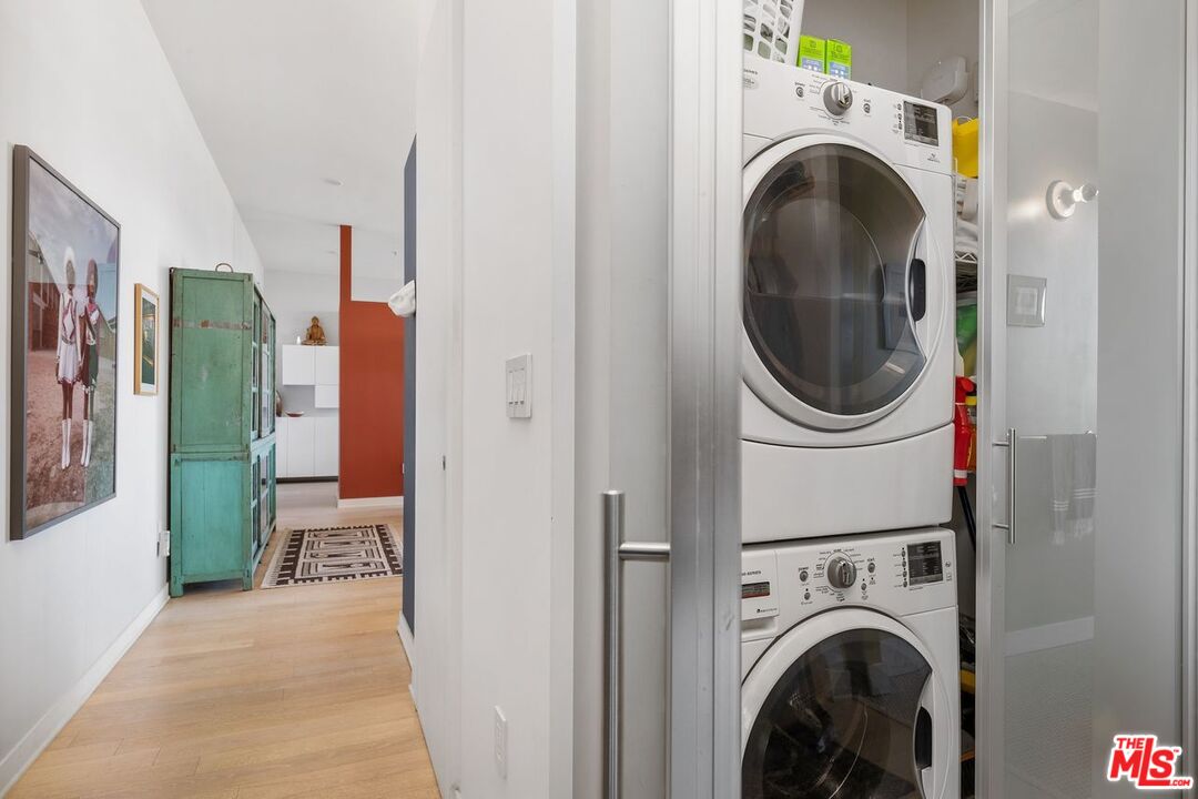 4080 Glencoe Avenue, Unit 420 Marina del Rey, CA 90292 - Photo 25 of 40 a view of a hallway with washer and dryer