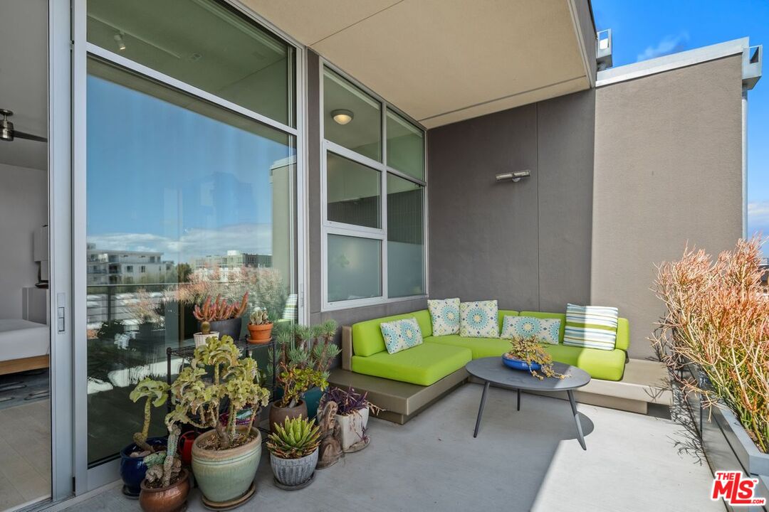 4080 Glencoe Avenue, Unit 420 Marina del Rey, CA 90292 - Photo 31 of 40 a blue bench sitting in front of a window