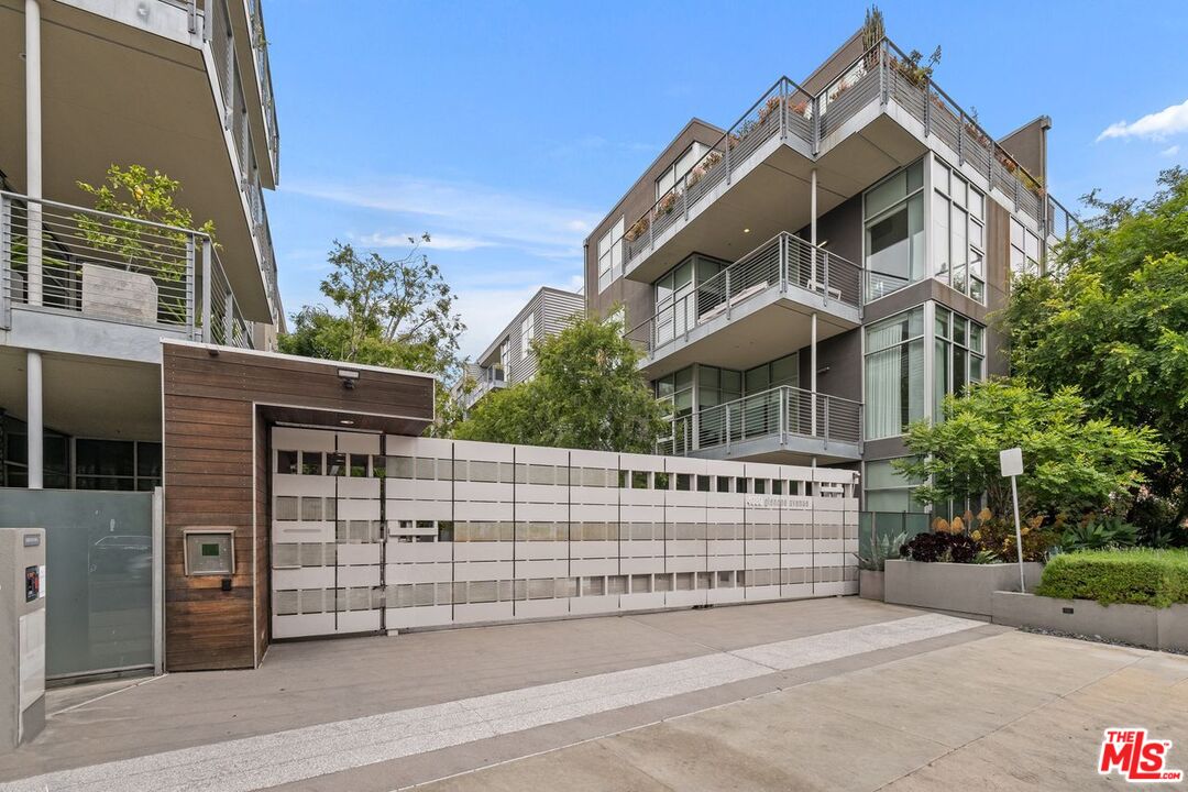 4080 Glencoe Avenue, Unit 420 Marina del Rey, CA 90292 - Photo 33 of 40 a view of a house with a small yard and wooden fence