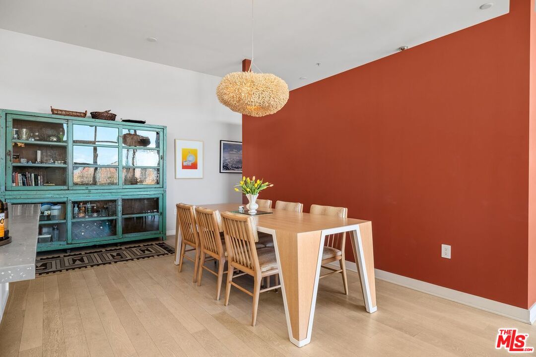 4080 Glencoe Avenue, Unit 420 Marina del Rey, CA 90292 - Photo 7 of 40 a dining room with furniture and wooden floor