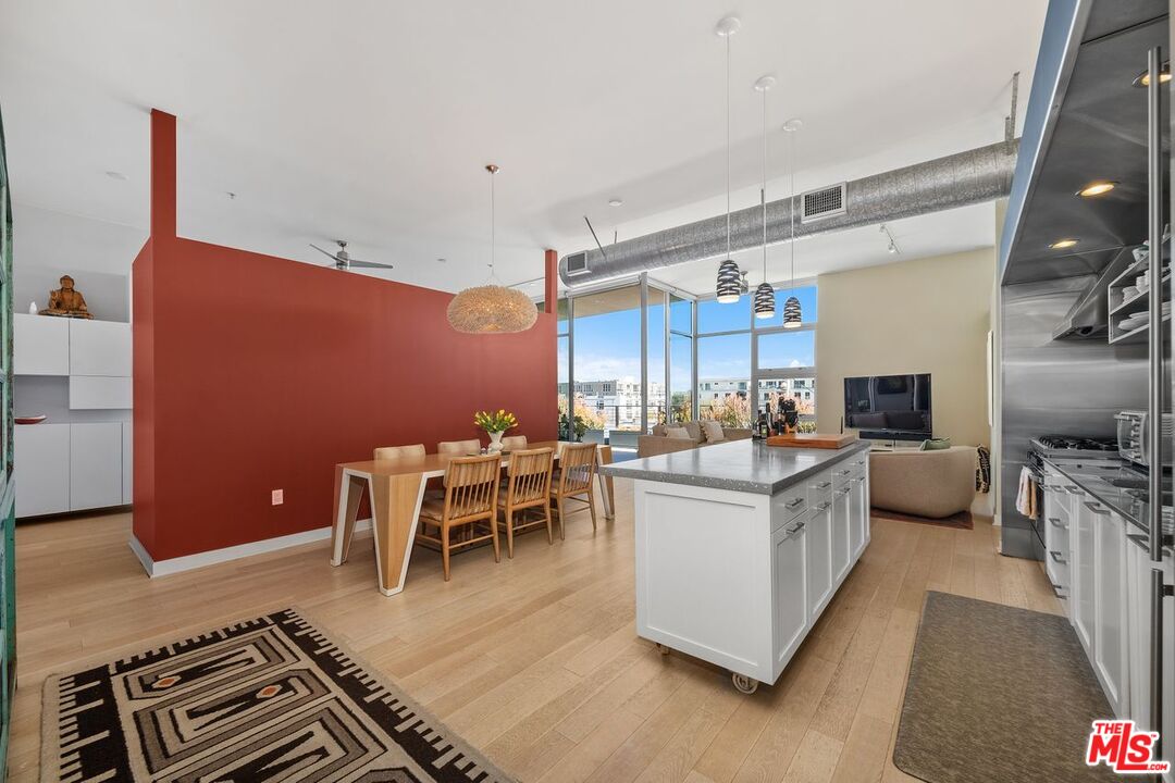 4080 Glencoe Avenue, Unit 420 Marina del Rey, CA 90292 - Photo 8 of 40 a living room with lots of furniture and kitchen view