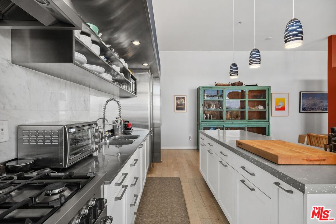 4080 Glencoe Avenue, Unit 420 Marina del Rey, CA 90292 - Photo 10 of 40 a kitchen with a stove and a wooden floor