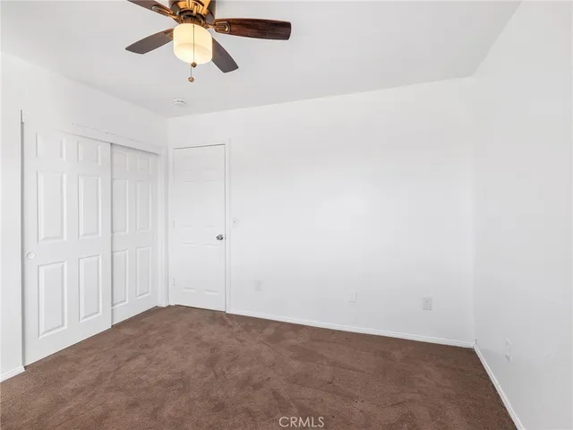 a view of a big room with carpet