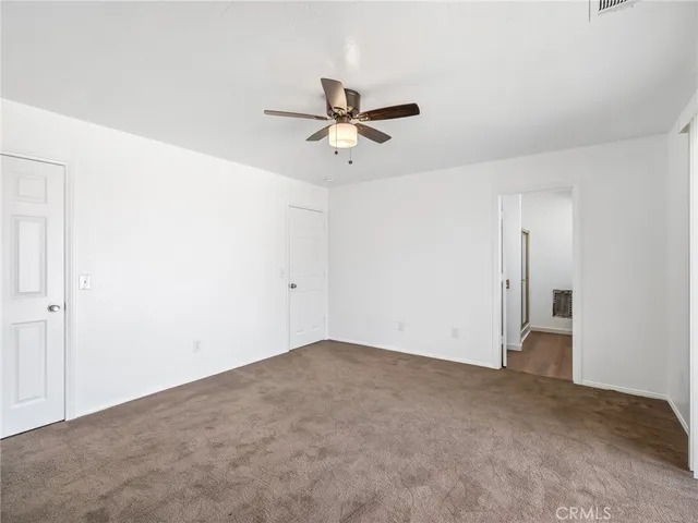 an empty room with fan