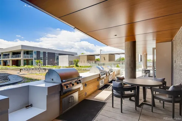 a swimming pool with outdoor seating and yard