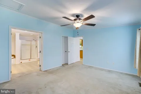 a room with a sink and a mirror