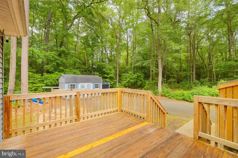 a view of a room with wooden walls