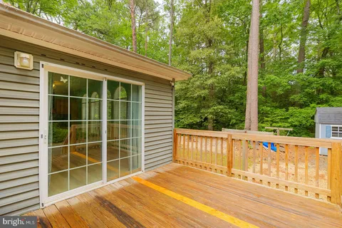 a view of a backyard with swimming pool