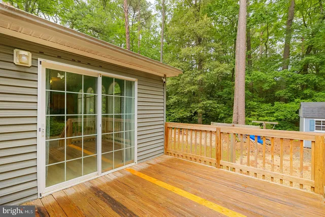 a view of a backyard with swimming pool
