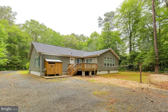 a view of a backyard with a sitting area