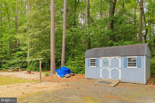 an aerial view of a houses with swimming pool