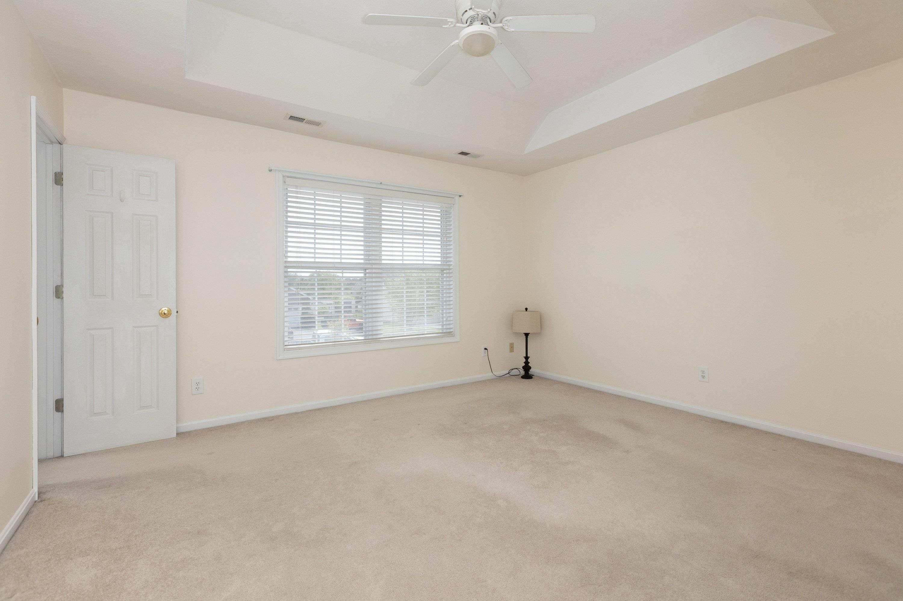 536 Three Leagues Road McGaheysville, VA 22840 - Photo 18 of 71 an empty room with a window and a ceiling fan