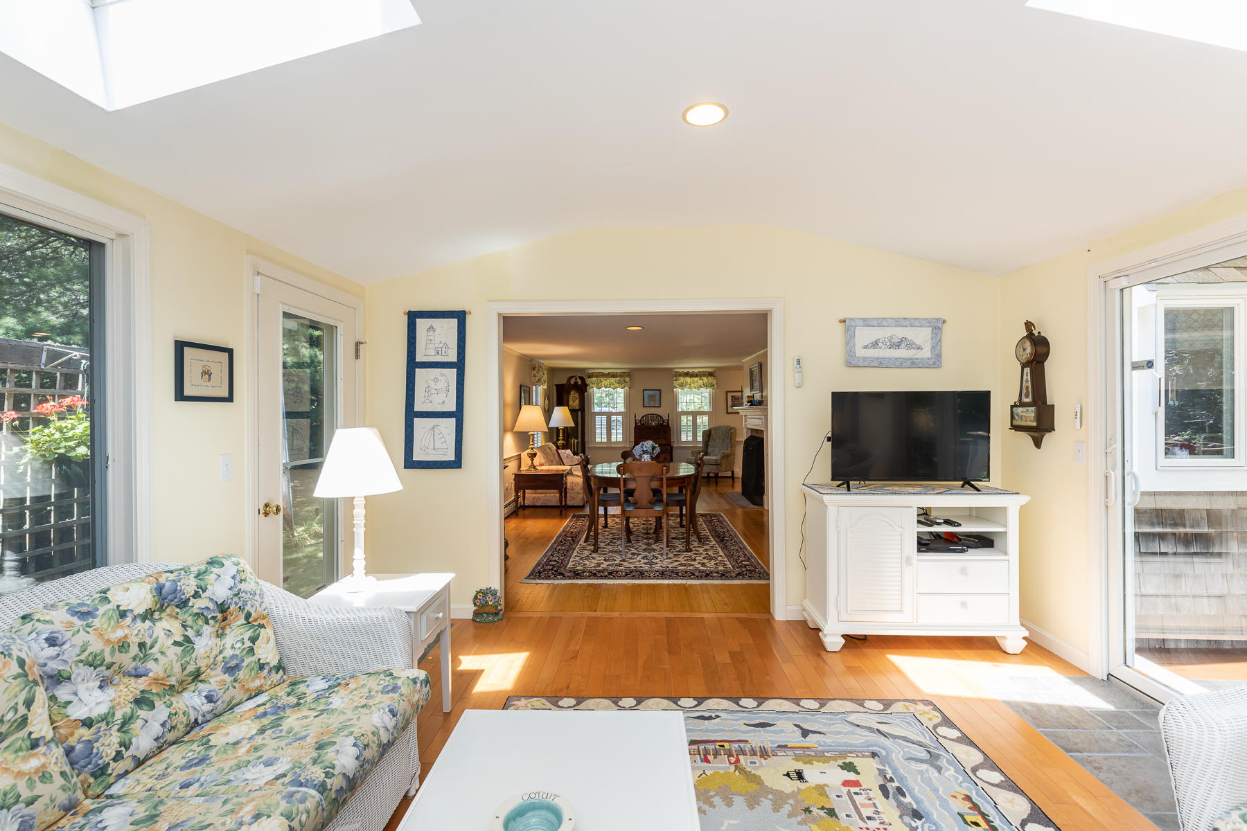 230 Santuit Road Cotuit, MA 02635 - Photo 12 of 46 a living room with furniture and a flat screen tv