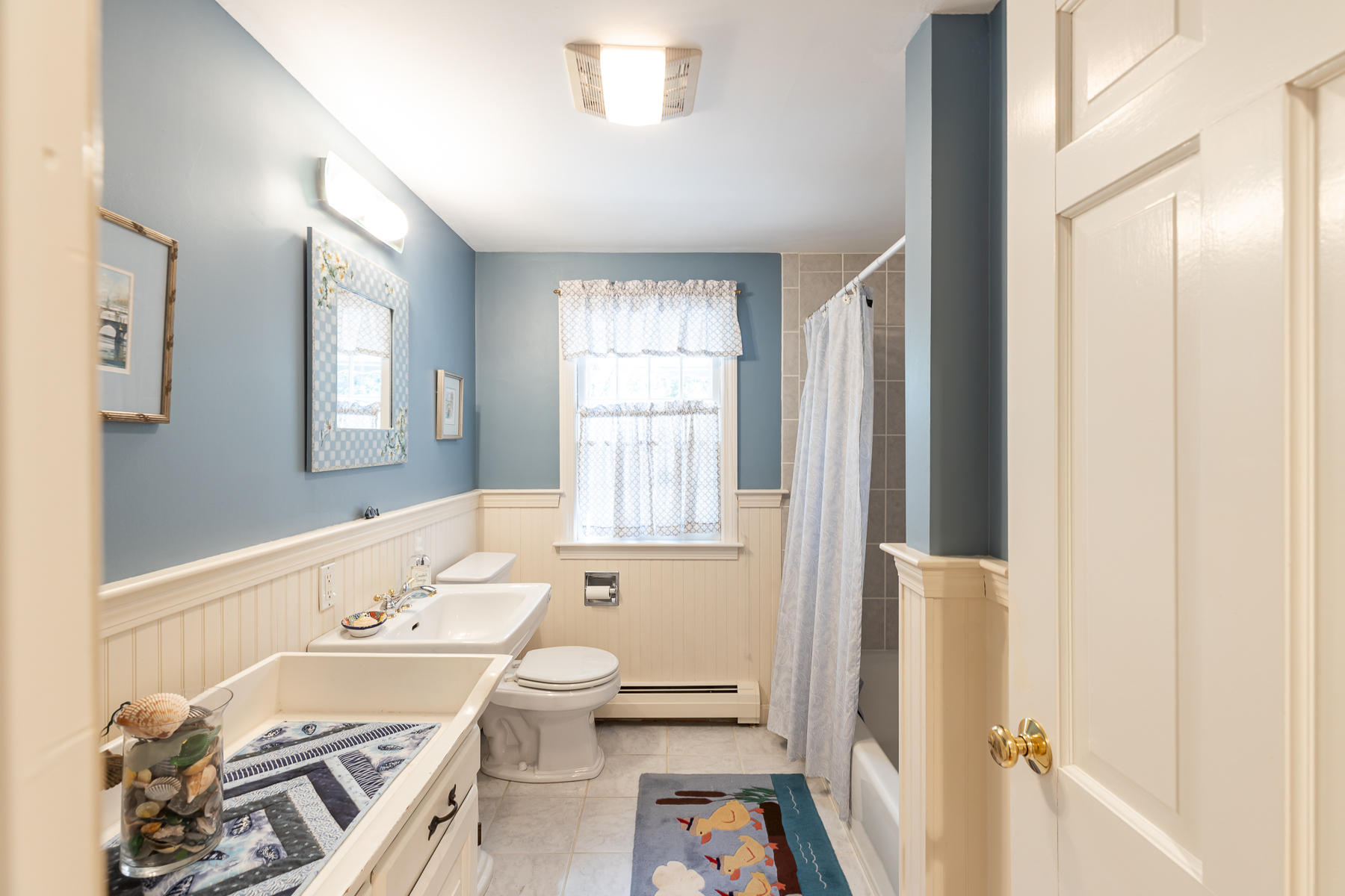 230 Santuit Road Cotuit, MA 02635 - Photo 13 of 46 a bathroom with a sink a toilet and a bathtub