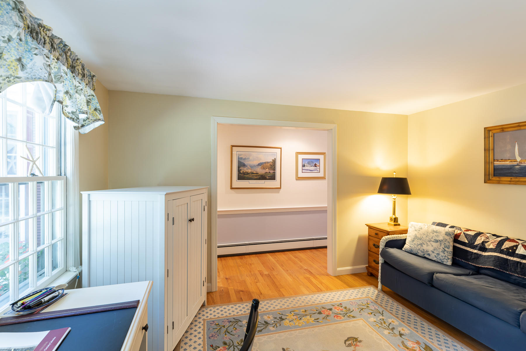 230 Santuit Road Cotuit, MA 02635 - Photo 15 of 46 a bedroom with a bed and wooden floor