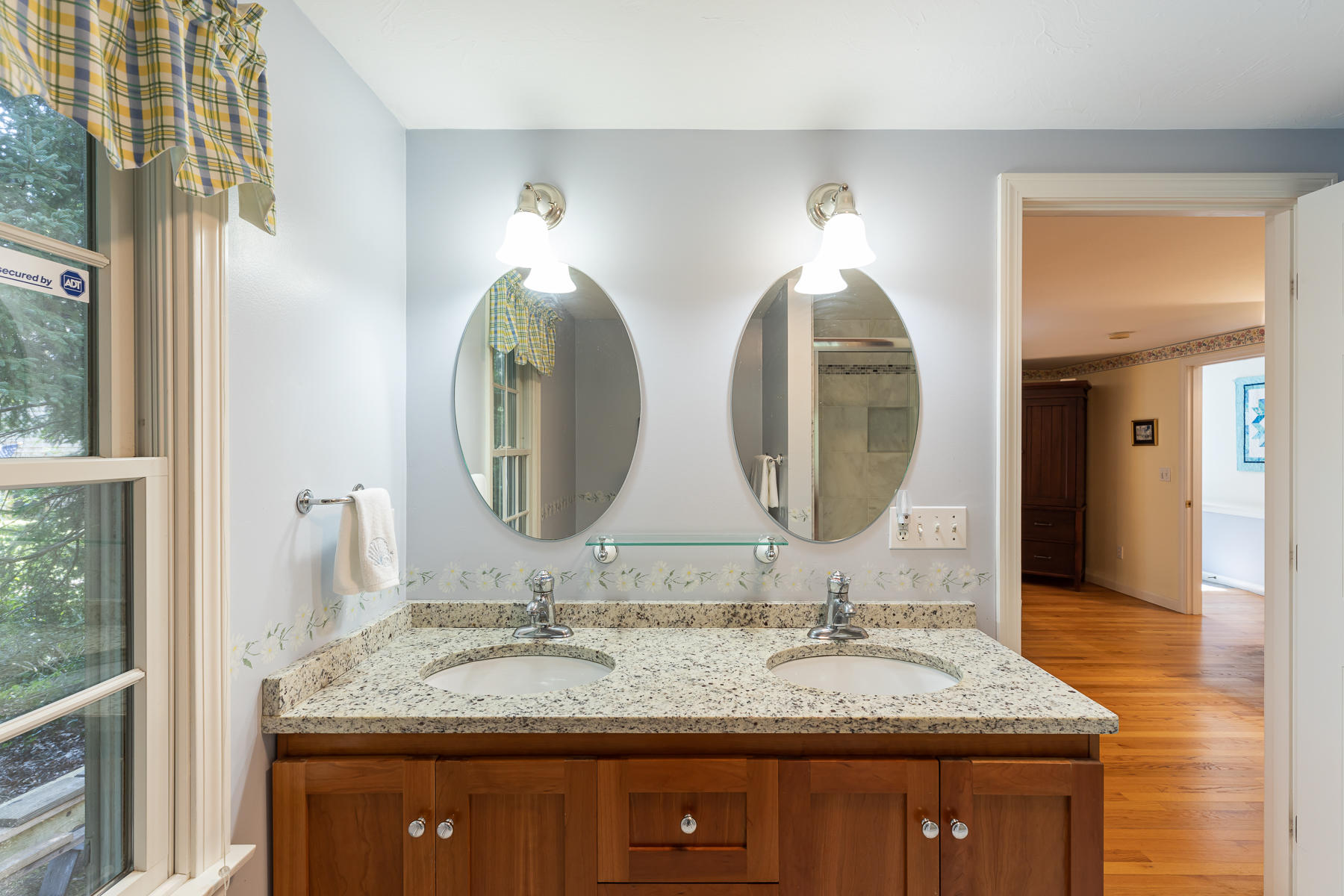 230 Santuit Road Cotuit, MA 02635 - Photo 22 of 46 a bathroom with double vanity sinks and a mirror