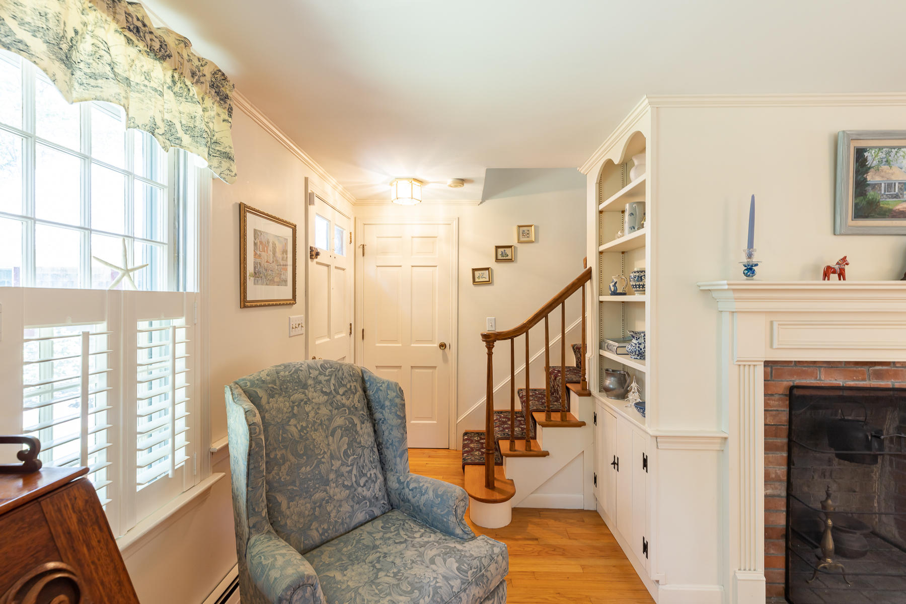 230 Santuit Road Cotuit, MA 02635 - Photo 23 of 46 a living room with furniture and a fireplace
